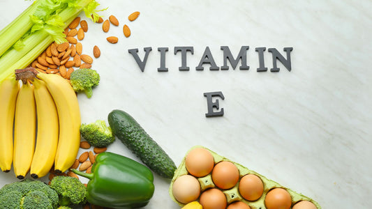 An array of foods with vitamin e and the "Vitamin E" written in letters
