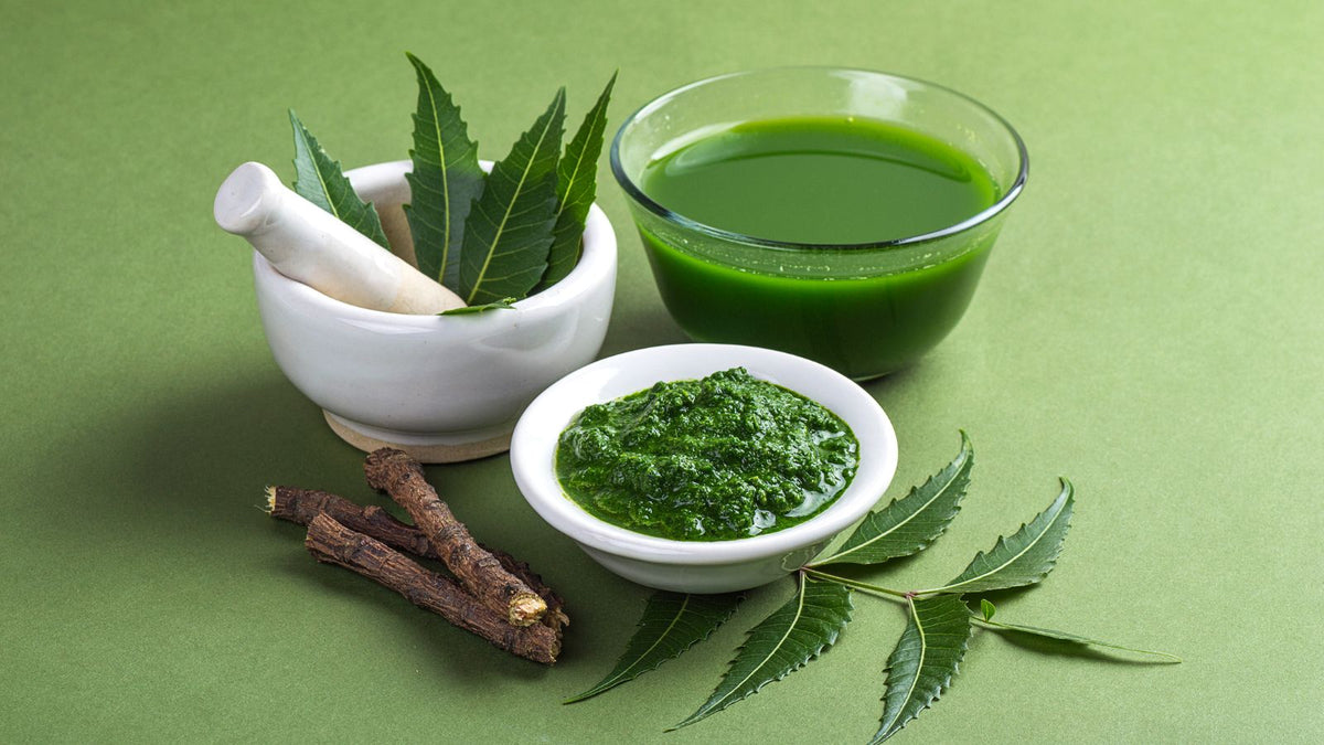 Neem leaves, juice and paste with a pestle and morter 