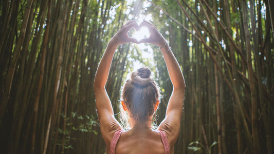 woman doing yoga in bamboo forest