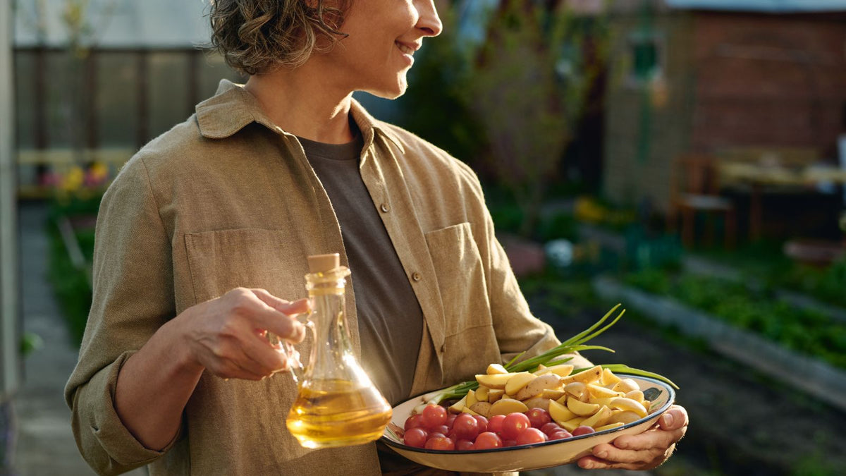 woman holding olive oil