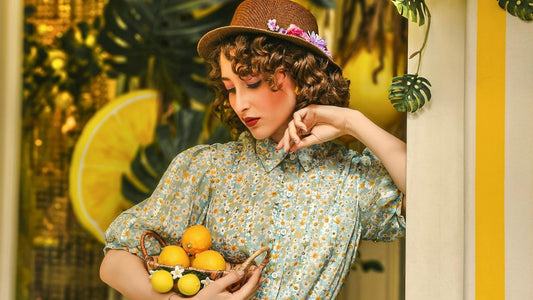 woman looking at a basket of lemons