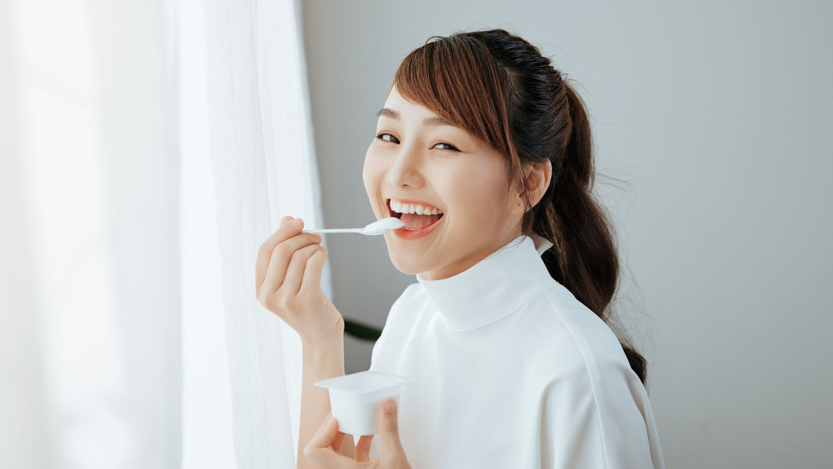 woman eating yogurt