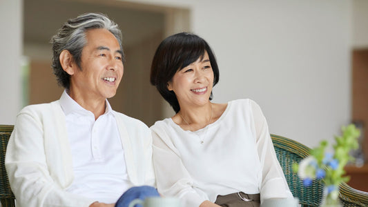 older Asian couple sitting together