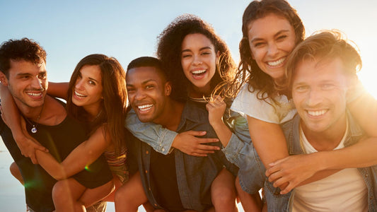 group of mixed skin color 20 year olds on beach
