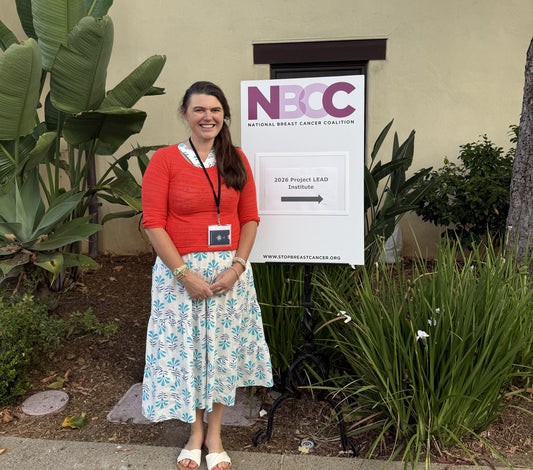 Lindsey Walsh standing next to the NBCC Project Lead sign